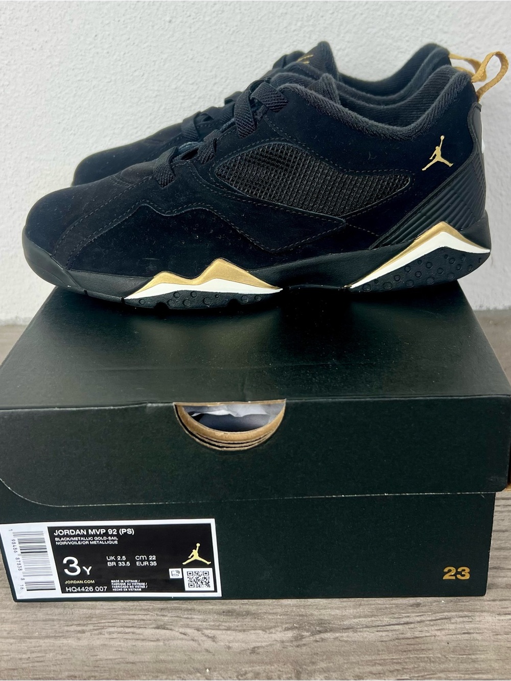 Jordan Black and Metallic Gold Low-Top Sneakers